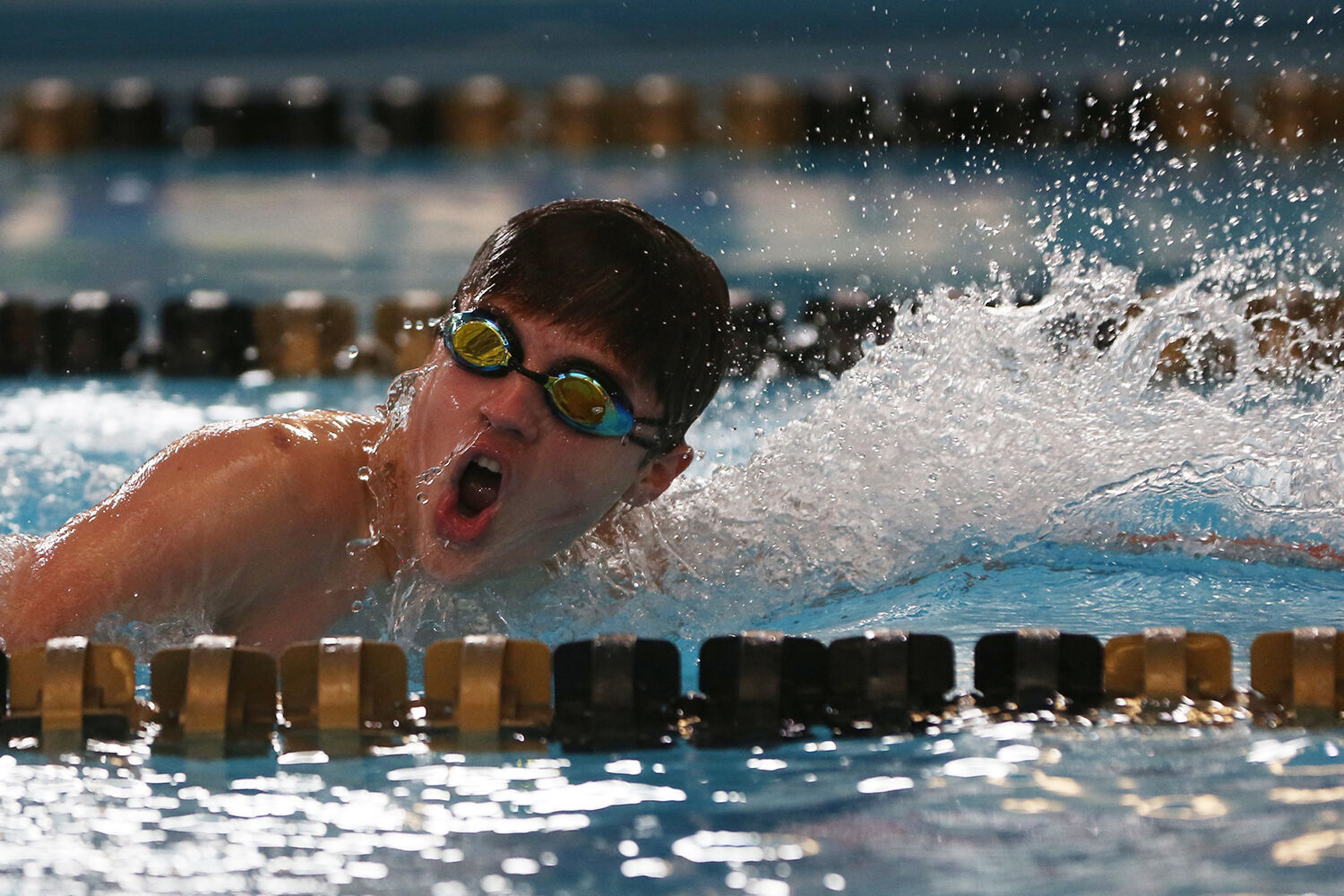 Mason Morrison takes a breath during the first heat of the 200 yard freestyle